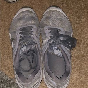 Grey Nike athletic shoes